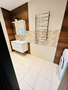 a bathroom with a shower and a sink at Svetes house - Garden & BBQ & Parking in Liepāja