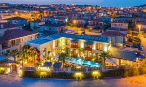 an aerial view of a building in a city at night at Dmira Alacati in Alaçatı