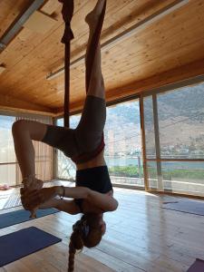a woman on a pole dancing in a room at Evia Silence in Boufalo