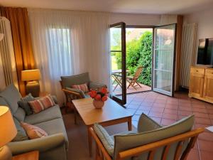 TV a/nebo společenská místnost v ubytování Ferienwohnung Abendstimmung mit Terrasse