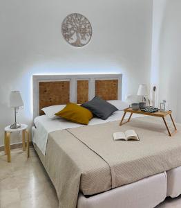 a bedroom with a large bed with a table on it at B&B Stella Dei Venti in San Salvo