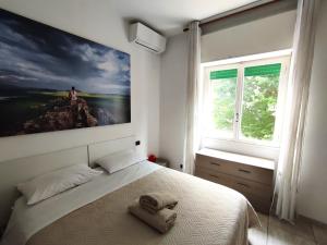 Postel nebo postele na pokoji v ubytování Easy Stay Verona Rooms