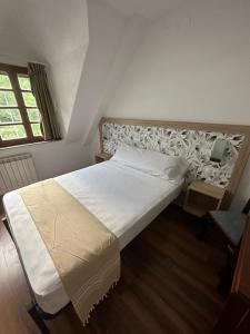 Postel nebo postele na pokoji v ubytování Hello Astur Green