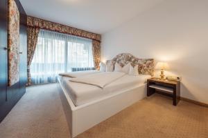 Posteľ alebo postele v izbe v ubytovaní Apartment Hotel Pfeifer