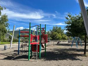 a park with a playground with a slide at Apartamento Cosy. Bonito y Acogedor Duplex in Latas