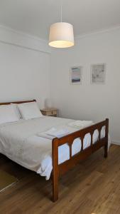 Ένα ή περισσότερα κρεβάτια σε δωμάτιο στο Ericeira Holidays