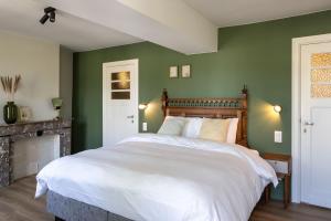 Postel nebo postele na pokoji v ubytování B&B Tannerie