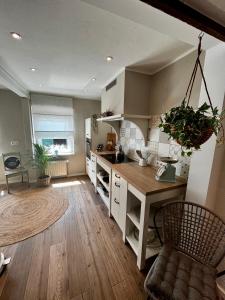 a kitchen with a wooden counter top in a room at Ferienwohnung Terrassenblick in Zülpich
