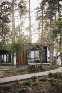 a house in the middle of the trees at Forest House Augustów in Augustów