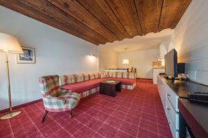 Televízia a/alebo spoločenská miestnosť v ubytovaní Apartment Hotel Pfeifer