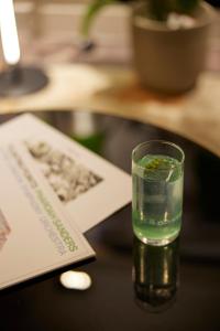 a glass of water sitting on a table at Teight Hotel in Thessaloniki