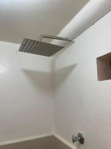 un estante en el techo de un baño en Maria Kulafu Studio Apartment Kinamaligan- Beside Eglin Gas FREE Wifi, en Masbate
