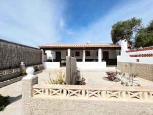 a white house with a fence in front of it at CASA VICENTE FUENTE in San Ferrán de ses Roques