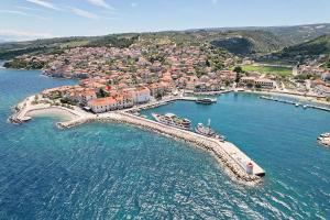 an aerial view of a town on the water at Spacious apartment 50 m from the beach in Postira
