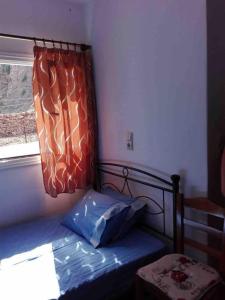 Postel nebo postele na pokoji v ubytování Spilios House
