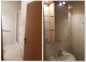 ein Bad mit einem Waschbecken und einer Dusche mit einem Spiegel in der Unterkunft Apartmán Tatran Donovaly in Donovaly