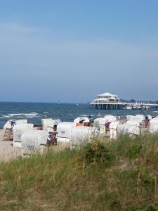 a row of beach huts on the beach near the ocean at Kleine Wohnung in Bad Schwartau in Bad Schwartau
