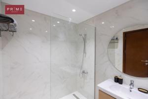a bathroom with a shower and a sink at Prime Select Galleria New Cairo in New cairo +58 photos