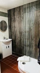 a bathroom with a toilet and a sink at Nightingale Cottage in Llantwit Major