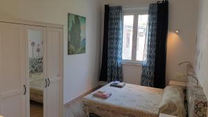 En eller flere senge i et værelse på Agriturismo Podere Il Fitto