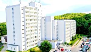 Budova, v ktorej sa apartmán nachádza + 4 fotografie