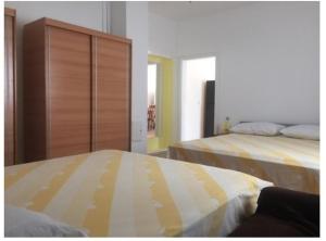 Łóżko lub łóżka w pokoju w obiekcie Apartment Olives