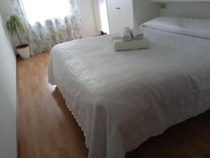 Postel nebo postele na pokoji v ubytování Pace e relax Riva del Garda