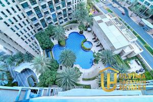 an overhead view of a swimming pool in a building at Stylish 1BR-Next to Dubai Mall in Standpoint B in Dubai