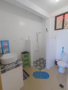 a bathroom with a sink and a toilet at Truth be Found Ministry Resort in Jagna