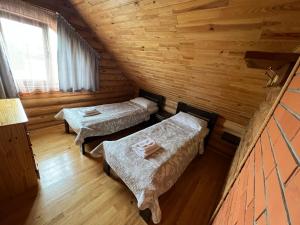 Postel nebo postele na pokoji v ubytování Боброва-Хата