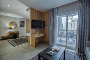 TV a/nebo společenská místnost v ubytování Locanda Museum Hotel