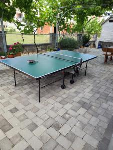 a ping pong table sitting on top of a patio at Apartments Lavendula in Vodice