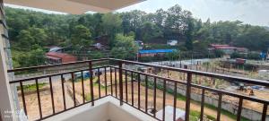 a balcony with a view of a construction site at MOCAHM in Shillong