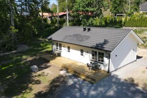 an overhead view of a house with a deck at Villa sjöviken 24 in Kolmården