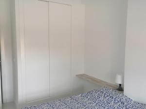 Łóżko lub łóżka w pokoju w obiekcie Campoamor Seaview