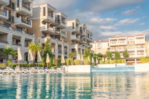 a rendering of a building with water in front at Green Life Apartments Sozopol in Sozopol