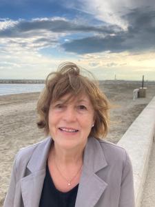 a woman standing on the beach near the ocean at Escapade Vallée du Doux in Tournon-sur-Rhône