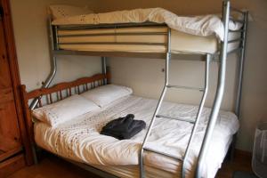 a bedroom with two bunk beds in a room at Flo's Cottage self-catering in Newark upon Trent