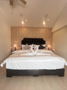 A bed or beds in a room at Dao Residence Boutique Apartment