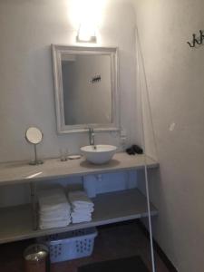a bathroom with a sink and a mirror at Maison Blanche in Laroque-des-Albères +10 photos
