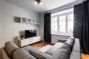 Televízia a/alebo spoločenská miestnosť v ubytovaní Stylish apartment next to Schwedenplatz
