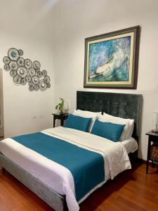 Säng eller sängar i ett rum på Hotel Porton de Granada