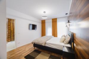 Ένα ή περισσότερα κρεβάτια σε δωμάτιο στο Chocolate Delight at West Residence