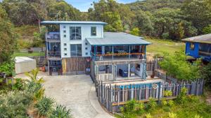 an aerial view of a house with a fence at Kahala in Point Lookout