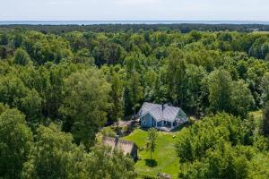 an aerial view of a house in the woods at Modern villa with sauna & hot tub in Hiiumaa