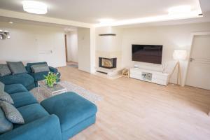 Posezení v ubytování Palmowe Wzgórze Skoszewo - Luksusowe Apartamenty