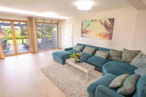 Posezení v ubytování Palmowe Wzgórze Skoszewo - Luksusowe Apartamenty