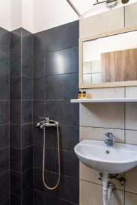 a bathroom with a sink and a shower at Eleftheria Studios in Antiparos