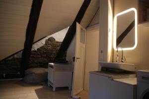 a bathroom with a sink in a attic at Airolo with private parking in Airolo +50 photos