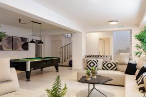 a living room with a pool table at Villa Palena in Chania